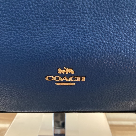 Blue leather Coach tote with brown signature strip on top. - Picture 2 of 7